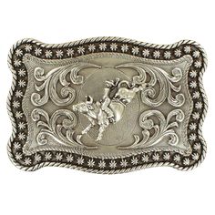 Style number: 3759002 Rectangle belt buckle Antique silver Bull rider in center Western filigree design Rope edge with rounded corners Measures: 4" x 2.25" Bull Rider, Mens Belt, Western Belt Buckles, Bull Riders, Filigree Pattern, A Bull, Bull Riding, Western Belts, M F