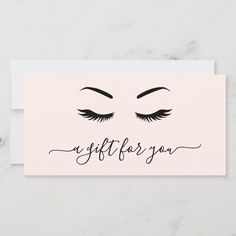 a white card with the words gift for you written in black ink on top of it