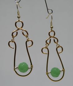 Unique Gold Jade Earrings, Elegant Green Wire Wrapped Hoop Earrings, Green Wire Wrapped Metal Earrings, Gold Wire-wrapped Jade Earrings, Green Chandelier Earrings As Gift, Unique Green Wire Wrapped Earrings, Green Brass Earrings With Wire Wrapping, Green Metal Teardrop Earrings, Jade Wire Wrapped Drop Earrings