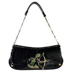 Presenting an incredible black snakeskin Dolce & Gabbana horoscope shoulder bag. Elevate your style with this exceptional black snakeskin Dolce & Gabbana horoscope shoulder bag, a coveted piece from the Fall/Winter 2004 collection. Meticulously crafted from black python skin, this flap bag is a testament to the brand's dedication to quality and sophistication. Embellished with a mesmerizing enamel and rhinestone covered Sagittarius symbol buckle, complemented by gold-tone hardware and a 'D' and Luxury Snake Print Evening Shoulder Bag, Vintage Luxury Bags, Purse Png, Dolce And Gabbana Bag, Sagittarius Symbol, Sagittarius Horoscope, Snake Bag, Italian Designers, Black Python