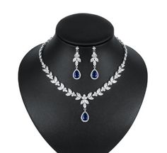 Sapphire Blue and Clear CZ Wedding Jewelry Set Complete your elegant bridal look with our fabulous sapphire blue CZ necklace and drop earring set. This silver plated jewelry set is adorned with brilliant CZ crystals in sapphire blue and clear that will add dazzling sparkle to any wedding or special occasion ensemble. Size: The necklace is 16" long and the pierced earrings are 1.85" long. Color: Silver/Sapphire blue. Style: ne1020S. This jewelry set would also be fabulous for the mother of the br Sapphire Necklace Set, Winter Wedding Accessories, Clear Bracelet, Formal Jewelry, Wedding Jewelry Set, Cubic Zirconia Necklace, Cz Necklace, Wedding Bridal Jewellery, Silver Plated Jewelry