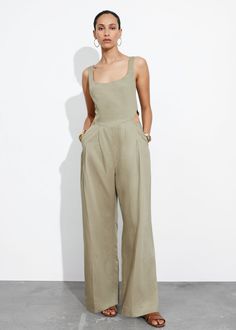 Sleeveless jumpsuit accented with cut-out detailing at the waist.• Square neckline• Smocked detailing at the back• Duo inseam pockets• Duo welt pockets at the back• Length of inseam:76cm / 29.9" (EU 36 / UK 8 / US 4) Casual Cutout Jumpsuits And Rompers For Spring, Casual Spring Jumpsuits And Rompers With Cutout, Chic Workwear Jumpsuits And Rompers With Side Pockets, Casual Summer Jumpsuits And Rompers With Cutout, Summer Casual Jumpsuits And Rompers With Cutout, Sleeveless Jumpsuits And Rompers For Summer, Chic Jumpsuits With Side Pockets, Chic Jumpsuits And Rompers With Side Pockets, Chic Jumpsuits And Rompers With Side Pockets For Spring