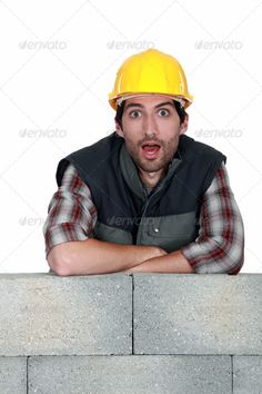 a construction worker with his arms crossed looking at the camera - stock photo - images