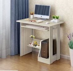 a desk with a computer on top of it