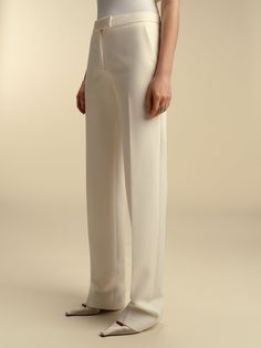 Founded in 2016 by sisters Marina and Francesca Moscone, the label gravitates toward a tactile approach, twisting and draping fabrics by hand to create a softly seductive design using custom jacquards, fil-coupés, and silk wools, all exclusively developed in Italy, rendered in precise shapes and tailoring. These tailored straight trousers sit comfortably on the high hip and low waist. Product Details 72% polyester, 21% viscose, 7% elastane. Center front zip closure. Made in Italy. Care Instructi Draping Fabric, Slim Trousers, High Hips, Cotton Midi Dress, Straight Trousers, Silk Wool, Low Waist, Vintage Lace, The Label