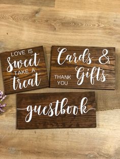 three wooden signs that say love is sweet, take a treat, and thank you guest book