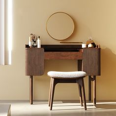 a vanity with a stool and mirror in the corner, next to it is a round mirror