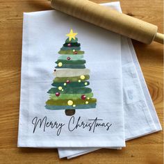 three napkins with christmas trees on them