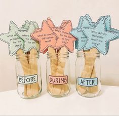 three mason jars filled with different colored stars