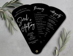 three black and white wedding programs with green leaves on the top one is for each guest