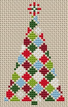 a cross stitch christmas tree with red, white and green ornaments on it's base