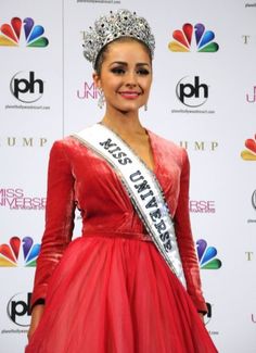 a woman in a red dress with a tiara