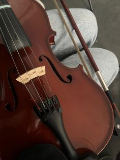 a violin sitting on top of a chair