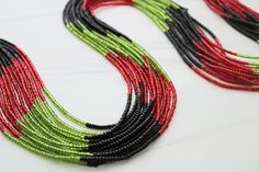 Red, black, and green traditional waist beads hand crafted in Ghana. ♥️🖤💚Strung on cotton string with no clasp.Made with glass seed beads. Fits up to 42 INCHES Comes with one strand Bead Size - Small Traditional Green Multi-strand Beads, Traditional Green Beaded Bracelets With Spacer Beads, Traditional Black Beaded Bracelets With Tiny Beads, Traditional Black Beaded Bracelets For Festive Occasion, Traditional Black Beaded Necklaces With Spacer Beads, Traditional Hand-strung Waist Beads For Festival, Green Beaded Necklace With Black Round Beads, Traditional Multicolor Waist Beads Gift, Traditional Multi-strand Black Beaded Necklaces