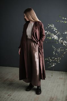 Emma long coat is made from 100% soft and washed medium weight linen. Details: - Colour: Chocolate - Composition: 100% Oeko-Tex certified linen - A shaped - Pockets - Linen belt included - 3 coconut buttons - Collar closes with button - Medium weight linen - Linen care: machine wash gentle; tumble dry low, ironing optional - The price is for one coat, other pictured items are not included Long Linen Outerwear For Fall, Brown Linen Outerwear With Relaxed Fit, Brown Relaxed Fit Linen Outerwear, Oversized Linen Long Coat, Relaxed Fit Long Linen Outerwear, Linen Coats Women, Linen Coat, Long Coat, Sewing Dresses