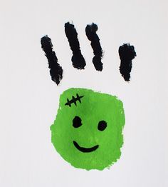 a handprint with a smiley face drawn on it's palm and two black fingers