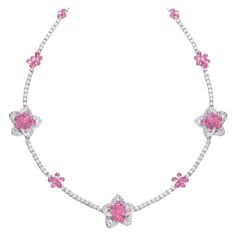 This uniquely stunning necklace is composed of 10.38 carats of round brilliant and rose-cut diamonds, and 37.55 carats of pink sapphires. The briolette cut allows the sapphires to dangle and move, allowing them to capture and reflect light at any angle. This charming necklace is the perfect combination of fun and delicate. Total length 16". Set in 18 karat white gold. Stamped Cellini Appraisal from Cellini Jewelers upon request Pink Diamond Necklace, Briolette Diamond, Diamond Flower Necklace, Pink Diamond Jewelry, Sapphire Diamond Necklace, Expensive Jewelry Luxury, Purple Sapphire, Jewelry Luxury, Expensive Jewelry