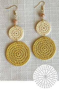 crocheted earrings with two circles and beads on the bottom, one is yellow