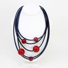 Five strands of rubber tubing feature various sizes of large Murano Glass beads to make our Galaxy Necklace. These exclusive necklaces are made by hand in Murano, Italy. A real statement piece, this necklace is absolutely stunning. Finished with a lobster clasp. Measures 30" in circumference. Approximately 10" from closure to longest point. Hand blown glass beads. Made in Murano, Italy. Large Beaded Necklaces, All Galaxies, Large Bead Necklace, Galaxy Necklace, Our Galaxy, Italian Leather Bags, Murano Italy, Murano Glass Beads, Valentines Necklace