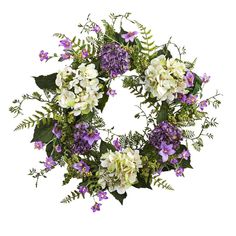 a wreath with purple and white flowers on it