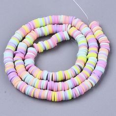 multicolored beads are arranged on a gray surface