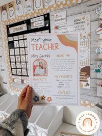 a person writing on a bulletin board in front of a wall covered with magnets