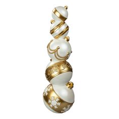 a white and gold christmas ornament with ornaments on it's sides, in the shape of three stacked balls