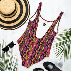 Inspired by the rich patterns of traditional Ghanaian Kente Cloth, this one-piece swimsuit is a standout choice for your beach days. With its vibrant pink design and flattering fit, it’s a fun and stylish way to show off your love for cultural patterns while enjoying the sun! This one-piece swimsuit for all figures will bring out your best features. Enjoy the smooth fabric and the flattering design, and show it off by the sea or pool! Country Wall Clock, Cultural Patterns, Kente Cloth, Swimsuits For All, Enjoying The Sun, Pink Design, Crop Sweatshirt, Beach Days, Cropped Hoodie