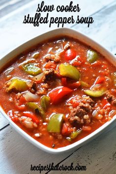 a white bowl filled with chili and meat soup