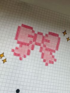 a piece of paper that has some type of pixel art on it and is cut out with scissors