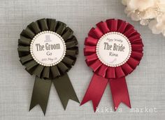 two ribbons with the bride and groom's names on them are next to each other