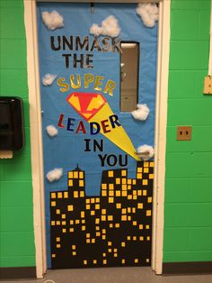 a door decorated with the words, unmask the super leader in you