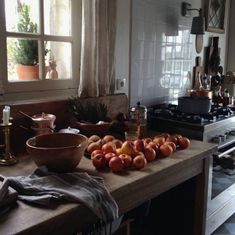 a kitchen counter topped with lots of apples