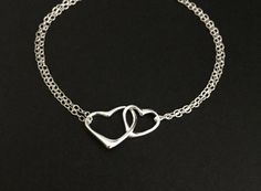 "♥ Sterling silver chain & clasp ♥ Double chained bracelet ♥ SMALL heart is measured 10x11mm ♥ LARGE heart is measured 13x15mm ♥ Solid sterling silver components ♥ Simple and elegant ♥ Bracelet size is the TOTAL length, which includes the spring clasp and the jump ring ♥ Petite bracelet size is 6 1/2\"; Standard bracelet size is 7\" ♥ Bracelet size guide: measure your wrist just below the wrist bone to get the wrist size ✤ For a smug fit (tighter) bracelet, wrist size + 1/2\" ✤ For a comfort Bracelet Valentines, Sterling Silver Heart Bracelet, Petite Necklace, Double Chain Bracelet, Sister Bracelet, Silver Heart Bracelet, Infinity Heart, Fitness Bracelet, Elegant Bracelet