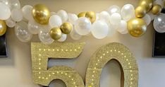 a 50th birthday decoration with balloons and streamers