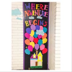 there is a door decorated with balloons and the words where adventure begins written on it