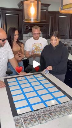 a group of people standing around a table with a giant checker board on it