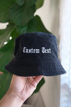 How to Order: Step 1: Please type in desired text along with the font name, i.e I don't work here (Old English font) Step 2: Pick a hat color. Step 3: Pick a thread color for the text. If you have any special requests or questions please feel free to message us! This is a great gift or piece for everyday wear. Direct embroidery, only available here at Embroidered Dad Hats! * Embroidered on a cotton bucket hat. * Small-Medium is 22" and Large-XL is 23.5" circumference. * Embroidered in Dallas, Te Embroidered Bucket Hat, Cotton Bucket Hat, Old English Font, Font Names, Poly Bags, Bucket Hats, Old English, Dallas Tx, Dad Hats