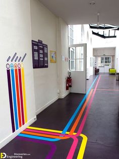 a hallway with colorful lines painted on the floor