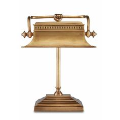 an antique brass desk lamp on a white background with clippings to the side