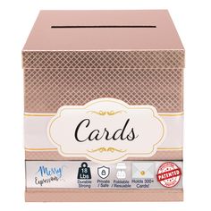 a pink card box with gold trimming and a white label on the bottom that says cards