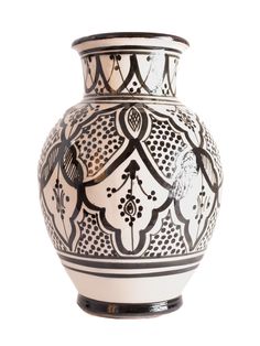 a black and white vase sitting on top of a table