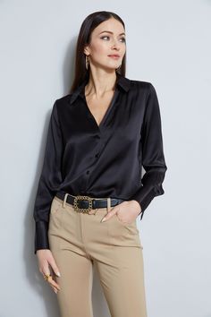 Nothing beats the chic factor and luxe patina of a Silk Satin shirt. Our button-down design features a v-neckline that is perfect for layering under a blazer or wearing on its own- you will live in this shirt all season long. Elie Tahari Exclusive Long Sleeve Silk Satin Button Down shirt 100% Silk Relaxed Fit; Runs true to size. Model is 5'9" and wearing size S Length From Shoulder to Hem: Back 26"L, Sleeve 32.5"L (approx. length for size S) Dry Clean Only Imported Style #: E107G513 Chic Semi-formal Blouse With Hidden Button Closure, Chic Button-up Blouse With Hidden Buttons, Elegant V-neck Top With Button Cuffs, Semi-formal Fall V-neck Top, Formal V-neck Shirt With Button Closure, Chic Button-up Business Casual Shirt, Chic Button-up Shirt For Business Casual, Chic Office Shirt With Button Closure, Chic Business Casual Button-up Shirt