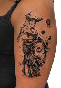 a woman with a cow tattoo on her arm