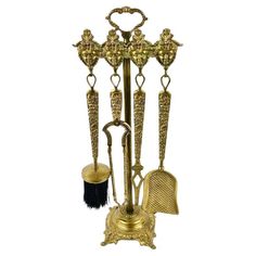 an ornate brass plated metal stand with three different items on it's sides