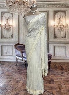 Beautiful cream net saree with sequins work and running blouse piece Glitter Falling, Net Blouses, Crepe Saree, Bleu Pastel, Net Saree, Organza Saree, Saree Look, Thread Work, Georgette Sarees