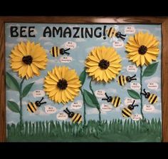 a bulletin board with bees and sunflowers on it