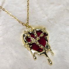 Gothic Heart Shaped Dripping Chain Red Crystal Gold Pendant Comes On A 16 Inch Gold Toned Stainless Steel Necklace With A Lobster Clasp And 1.5 Inch Extension Chain Red Aesthetic Jewelry, Red And Gold Accessories, Red And Gold Necklace, Gold Gothic Jewelry, Blood Jewelry, Descendants 4, Purple Pendant Necklace, Gothic Heart, Pineapple Necklace