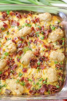 a casserole dish with chicken, bacon and green onions