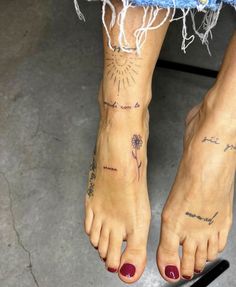 a woman's foot with tattoos on it